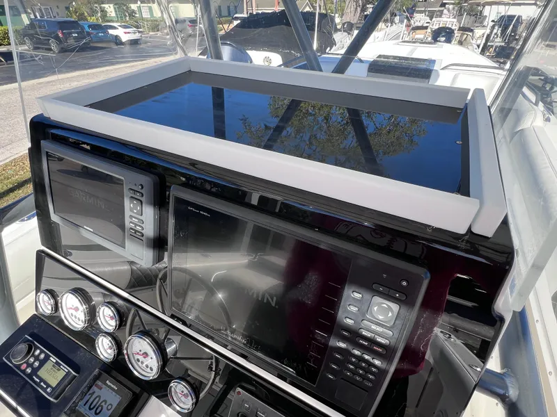 Slide: The Image of Control panel of a 1997 Dakota 32 cc boat with Suzuki Motors. - 14