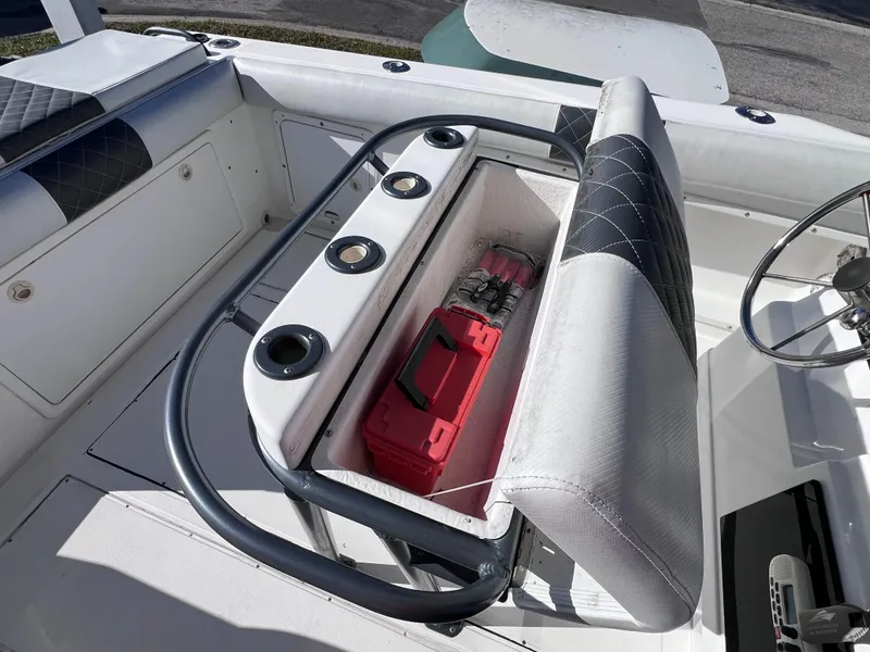 Slide: The Image of Boat seating with storage compartment, featuring a red toolbox, on a Dakota 32 cc 2023 Suzuki Motors. - 21