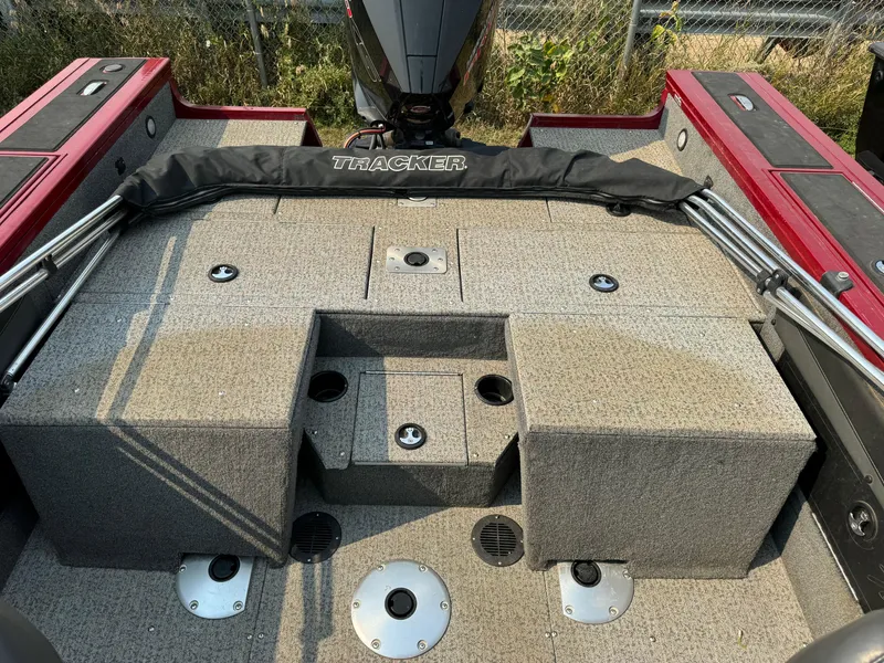 Slide: The Image of 2021 Tracker Targa V-19 Combo Tournament Edition boat interior with carpeted deck. - 5