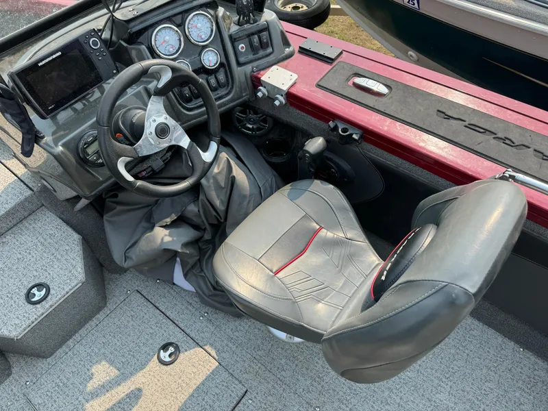 Slide: The Image of 2021 Tracker Targa V-19 Combo Tournament Edition boat interior with steering wheel and seat. - 6