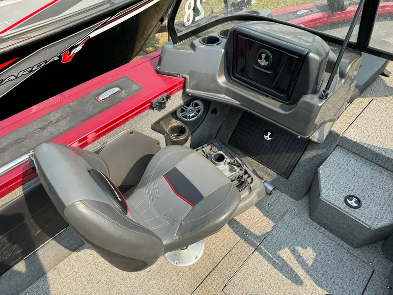 Slide: The Image of 2021 Tracker Targa V-19 Combo Tournament Edition boat interior with seating and console. - 9