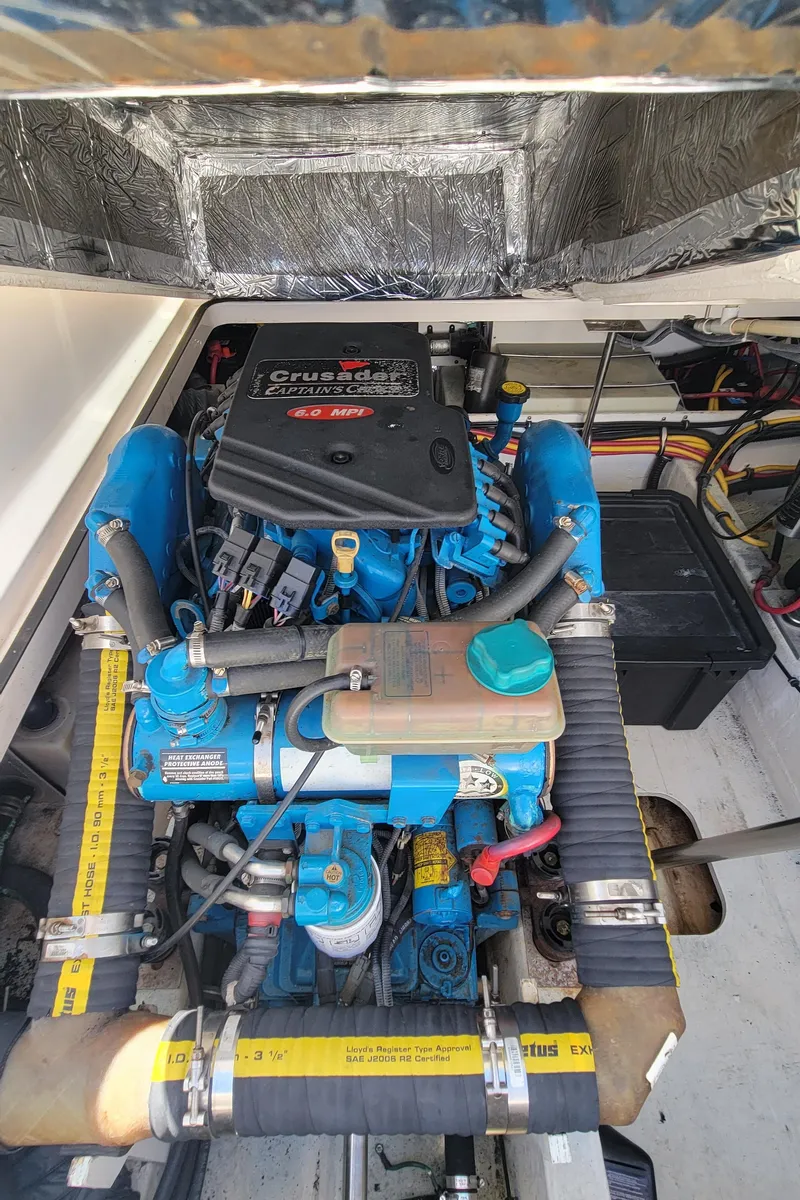 Slide: The Image of Engine compartment of 2006 Tiara Yachts 2900 Coronet, featuring a powerful marine engine. - 28