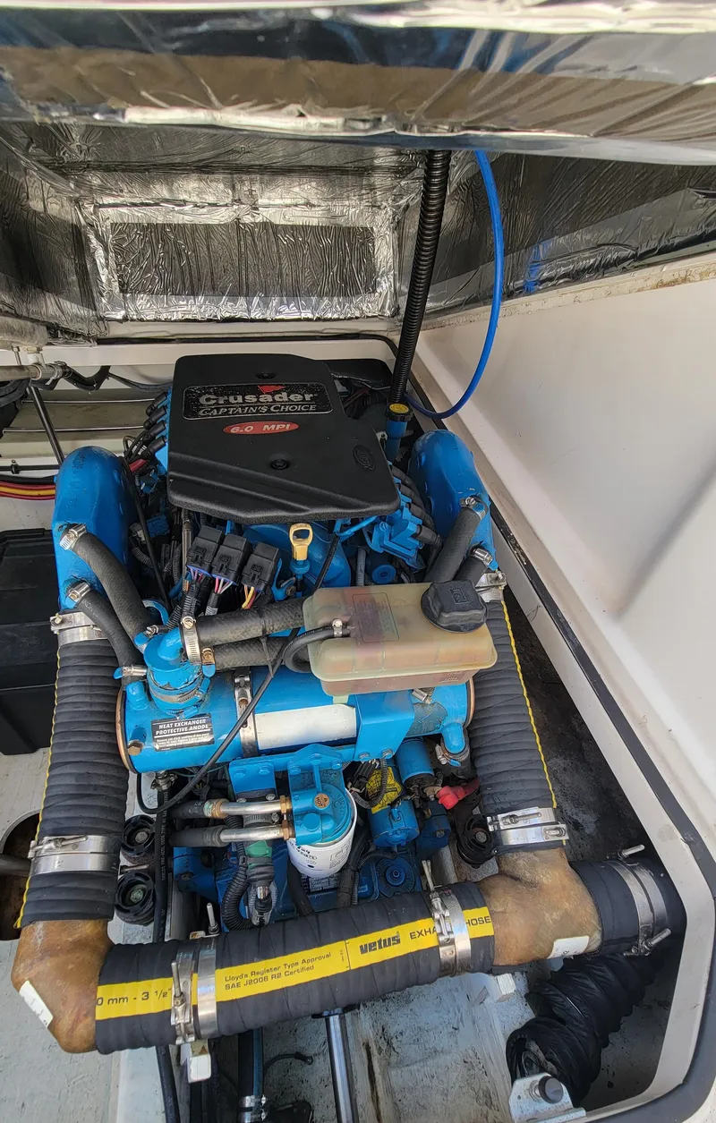 Slide: The Image of 2006 Tiara Yachts 2900 Coronet engine compartment with blue and black components. - 30