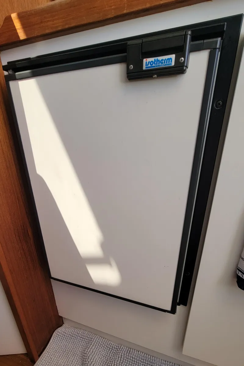 Slide: The Image of 2006 Tiara Yachts 2900 Coronet interior fridge with Isotherm label. - 21