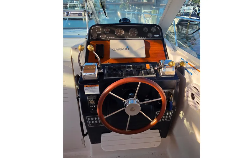 Slide: The Image of Helm of 2006 Tiara Yachts 2900 Coronet with Garmin navigation system and wooden steering wheel. - 14