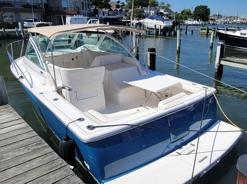 Slide: The Image of 2006 Tiara Yachts 2900 Coronet docked, featuring spacious seating and sleek design. - 2