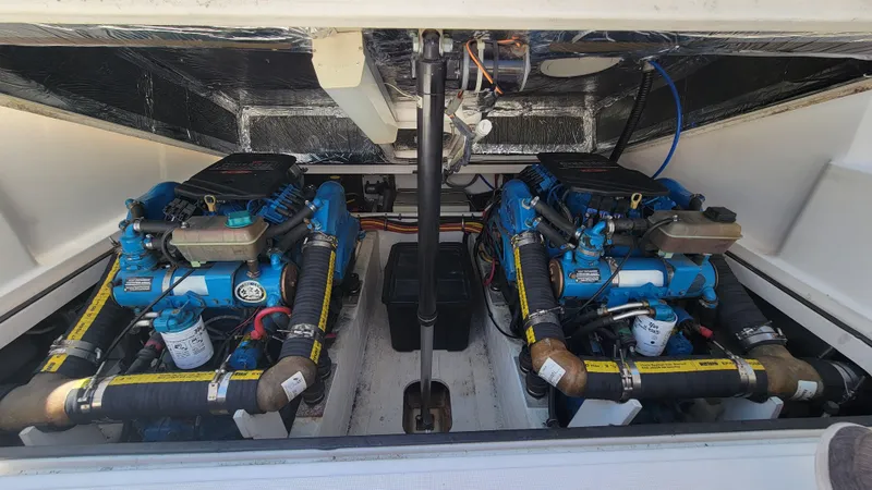 Slide: The Image of 2006 Tiara Yachts 2900 Coronet engine compartment with dual blue engines. - 27