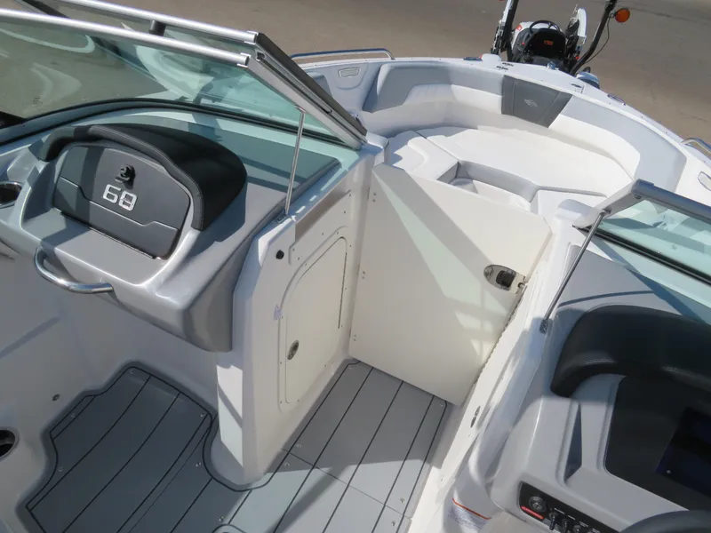 Slide: The Image of 2025 Chaparral 23 SSi boat interior with sleek design and modern dashboard. - 11