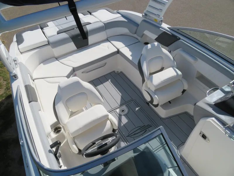 Slide: The Image of 2025 Chaparral 23 SSi boat interior with white seating and modern design. - 13