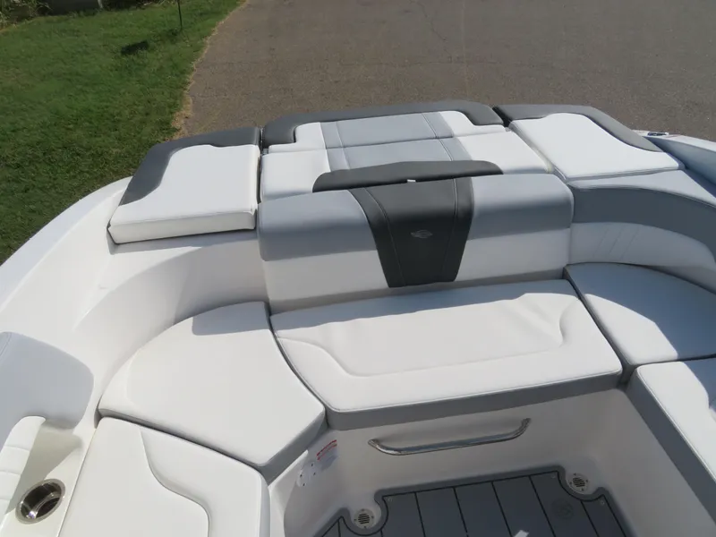 Slide: The Image of 2025 Chaparral 23 SSi boat interior with cushioned seating and sleek design. - 5