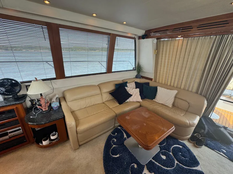 Slide: The Image of Luxurious interior of 2000 Carver 530 Voyager Pilothouse with leather seating and elegant decor. - 12