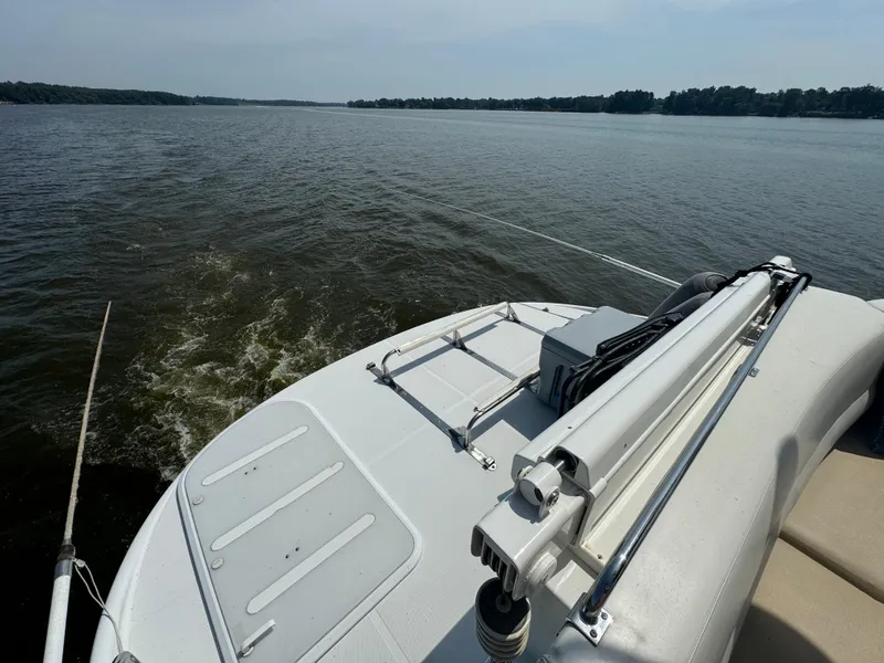 Slide: The Image of 2000 Carver 530 Voyager Pilothouse cruising on a calm lake. - 16