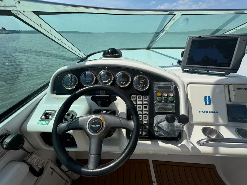 Slide: The Image of Pilothouse of 2000 Carver 530 Voyager with steering wheel and navigation instruments. - 20