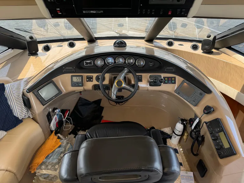 Slide: The Image of Pilothouse interior of 2000 Carver 530 Voyager, featuring steering wheel and navigation instruments. - 22