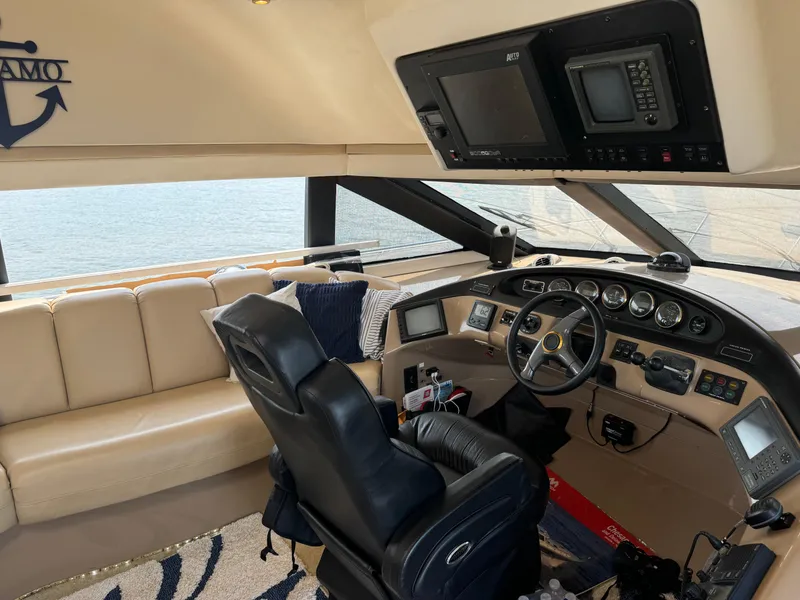 Slide: The Image of Pilothouse interior of 2000 Carver 530 Voyager, featuring leather seating and advanced navigation equipment. - 24