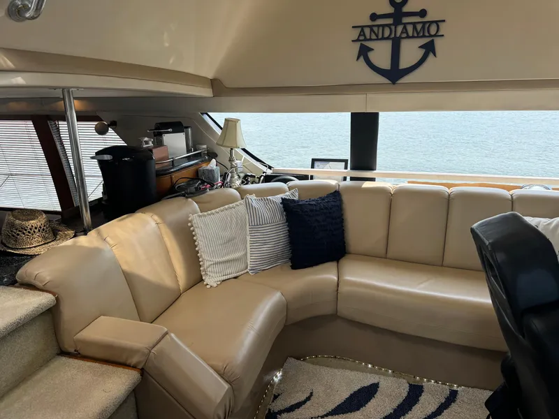 Slide: The Image of Interior of 2000 Carver 530 Voyager Pilothouse with beige seating and nautical decor. - 25