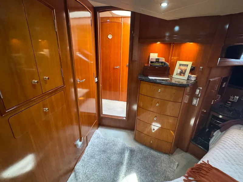 Slide: The Image of Luxurious interior of 2000 Carver 530 Voyager Pilothouse with wood cabinetry and cozy decor. - 30