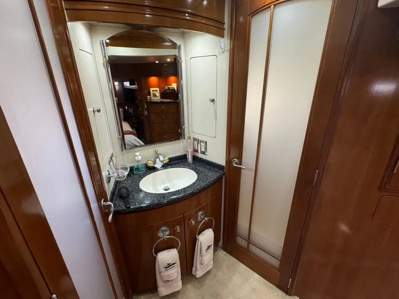 Slide: The Image of Luxurious bathroom in 2000 Carver 530 Voyager Pilothouse yacht with elegant wood finishes. - 35