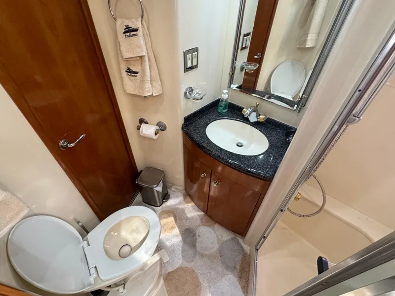 Slide: The Image of Bathroom interior of 2000 Carver 530 Voyager Pilothouse with sink, toilet, and shower. - 36