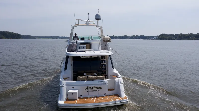Slide: The Image of 2000 Carver 530 Voyager Pilothouse yacht cruising on a calm lake. - 43