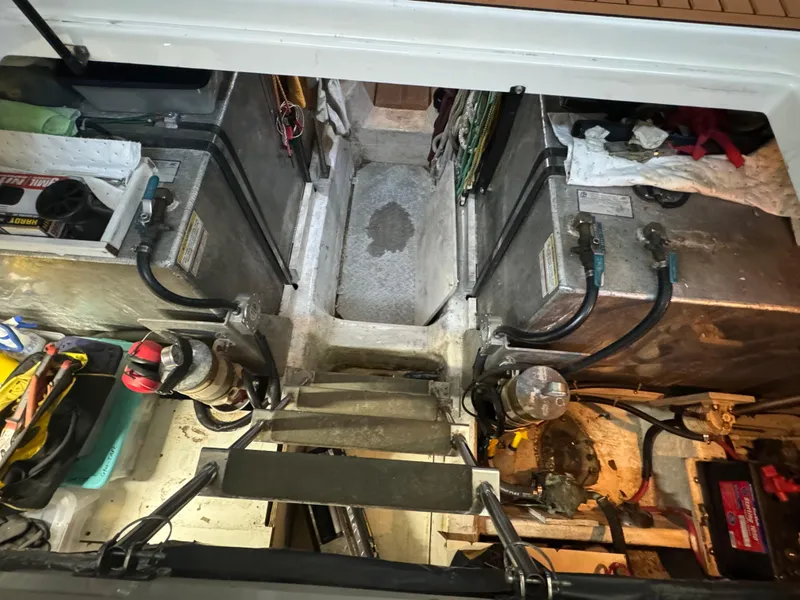 Slide: The Image of Engine room of 2000 Carver 530 Voyager Pilothouse with visible machinery and components. - 48