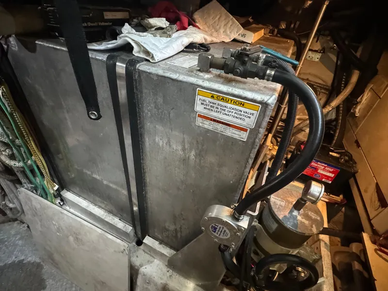 Slide: The Image of Engine room of 2000 Carver 530 Voyager Pilothouse with fuel tank and equipment. - 49