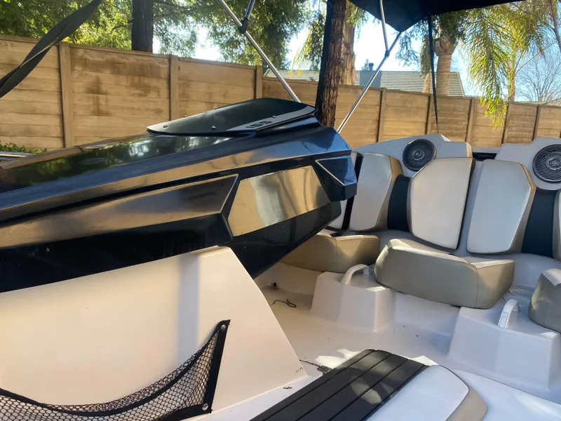Slide: The Image of 2015 Scarab 165 Standard boat interior with seating and speakers. - 20