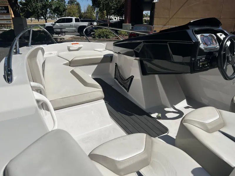 Slide: The Image of 2015 Scarab 165 Standard boat interior with sleek seating and modern dashboard design. - 31