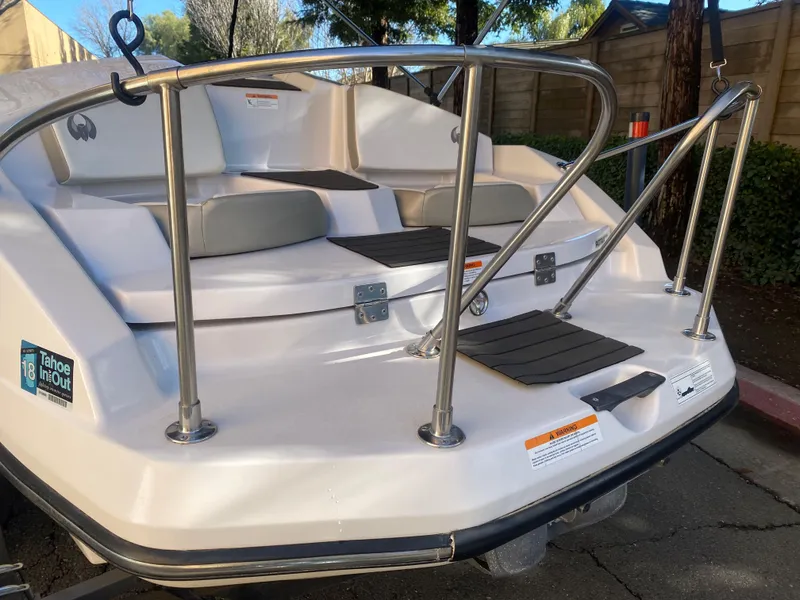 Slide: The Image of 2015 Scarab 165 Standard boat with rear seating and stainless steel railings. - 5