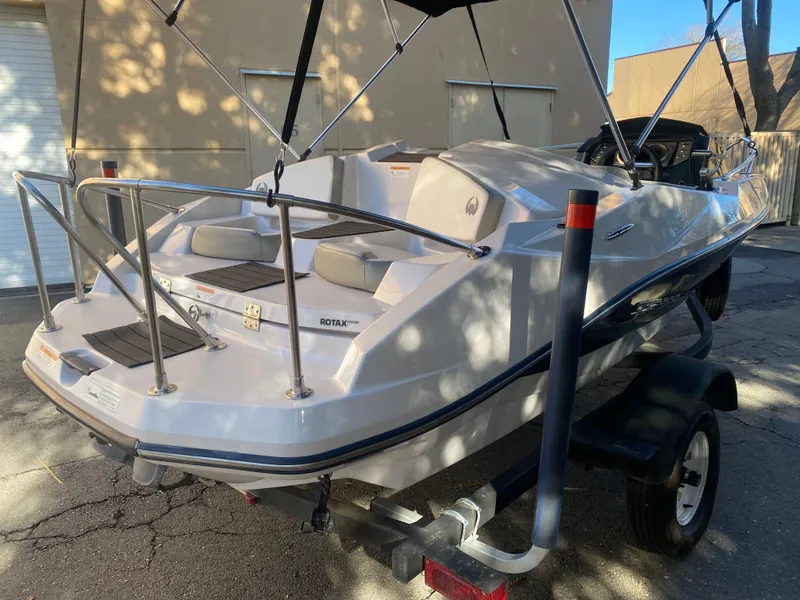 Slide: The Image of 2015 Scarab 165 Standard boat on trailer, rear view, outdoor setting. - 7