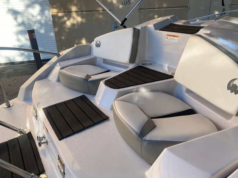 Slide: The Image of 2015 Scarab 165 Standard boat interior with cushioned seating and sleek design. - 8