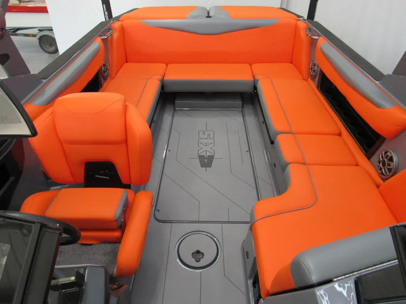 Slide: The Image of 2021 Axis T23 boat interior with vibrant orange and gray seating. - 10