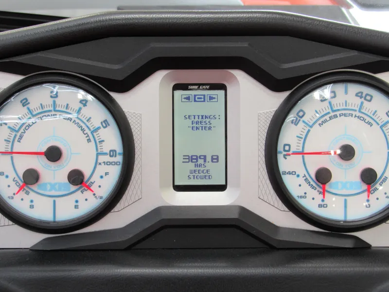 Slide: The Image of Dashboard of a 2021 Axis T23 boat with digital display and analog gauges. - 11