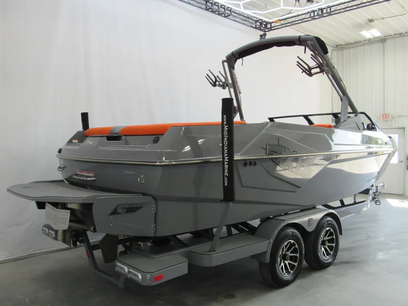 Slide: The Image of 2021 Axis T23 boat on trailer in indoor showroom. - 3