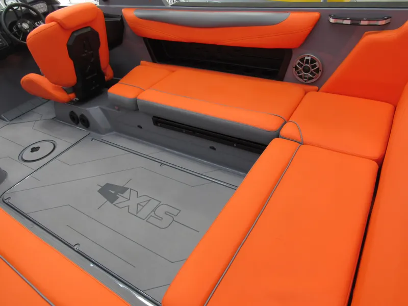 Slide: The Image of 2021 Axis T23 boat interior with vibrant orange seating and sleek design. - 5