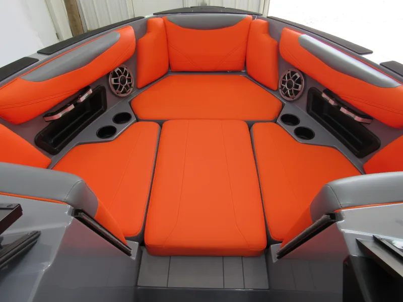 Slide: The Image of 2021 Axis T23 boat interior with vibrant orange seating and built-in speakers. - 9