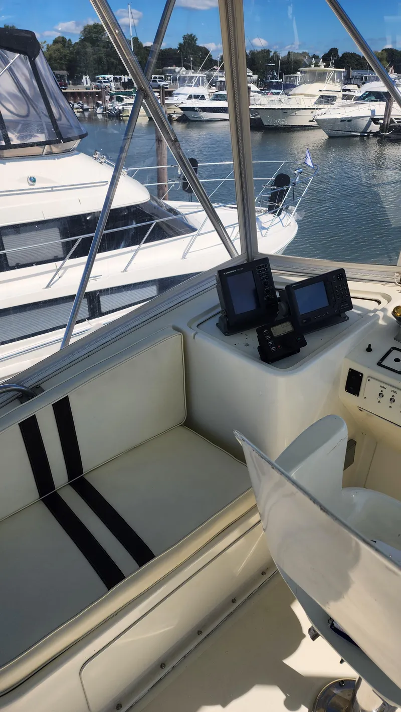 Slide: The Image of 1969 Hatteras 36 Sport Fisherman boat interior with navigation equipment, docked at marina. - 15