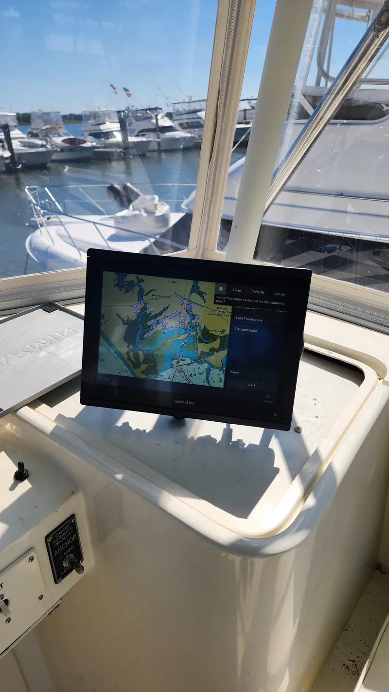 Slide: The Image of Navigation screen on 1969 Hatteras 36 Sport Fisherman boat, docked at marina. - 16