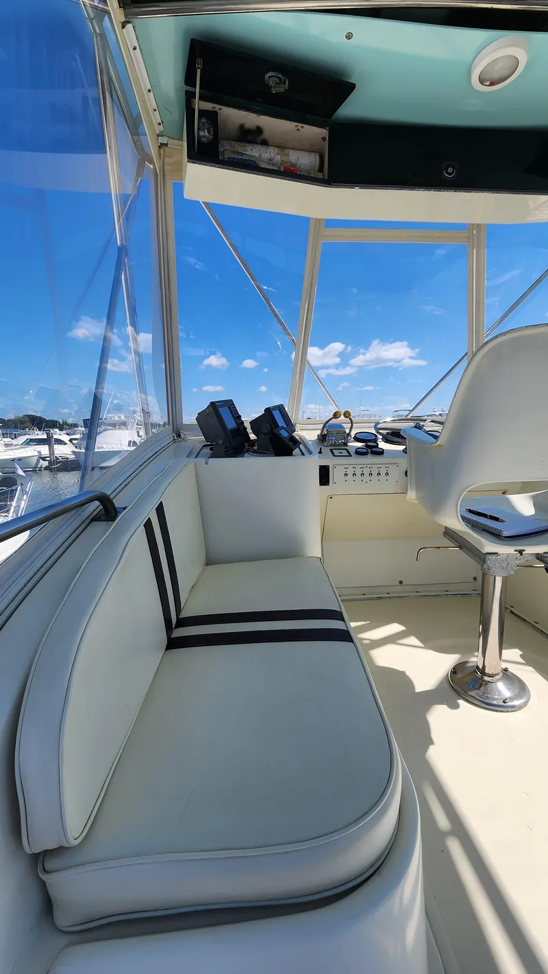 Slide: The Image of 1969 Hatteras 36 Sport Fisherman interior with seating and navigation equipment. - 19