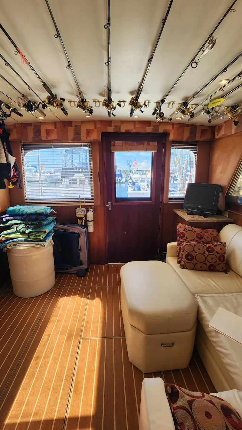 Slide: The Image of Interior of a 1969 Hatteras 36 Sport Fisherman with fishing rods and cozy seating. - 30