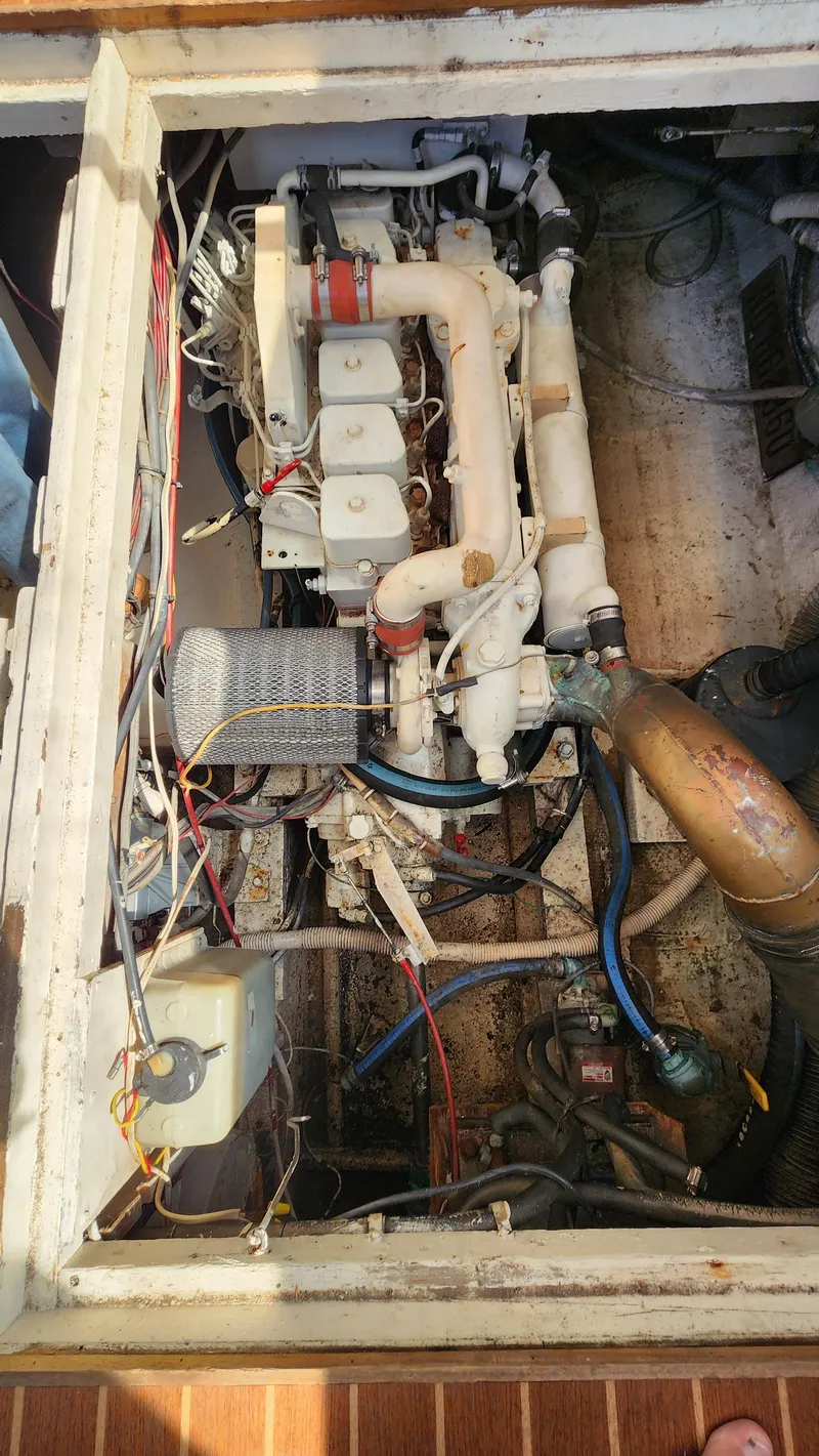 Slide: The Image of Engine compartment of a 1969 Hatteras 36 Sport Fisherman boat, showing wiring and components. - 31