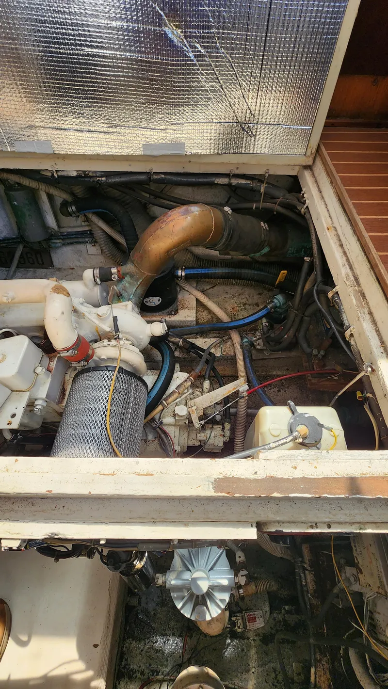 Slide: The Image of Engine compartment of a 1969 Hatteras 36 Sport Fisherman boat, showing mechanical components. - 35