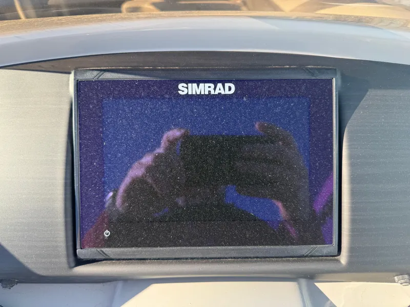 Slide: The Image of Simrad display on 2023 Bennington 23SX Swingback boat dashboard. - 3