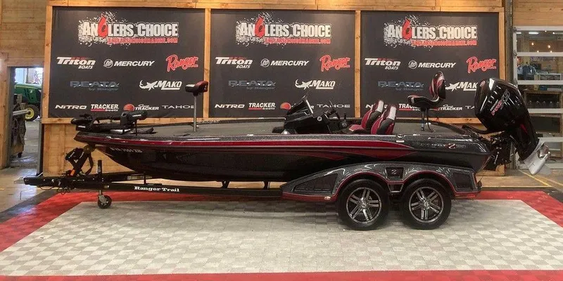 The Image of 2022 Ranger Z520R bass boat displayed indoors with promotional banners in the background. - 1