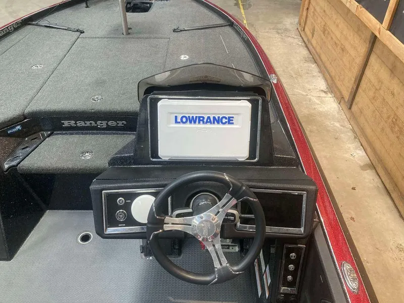 Slide: The Image of 2022 Ranger Z520R boat dashboard with Lowrance display and steering wheel. - 7