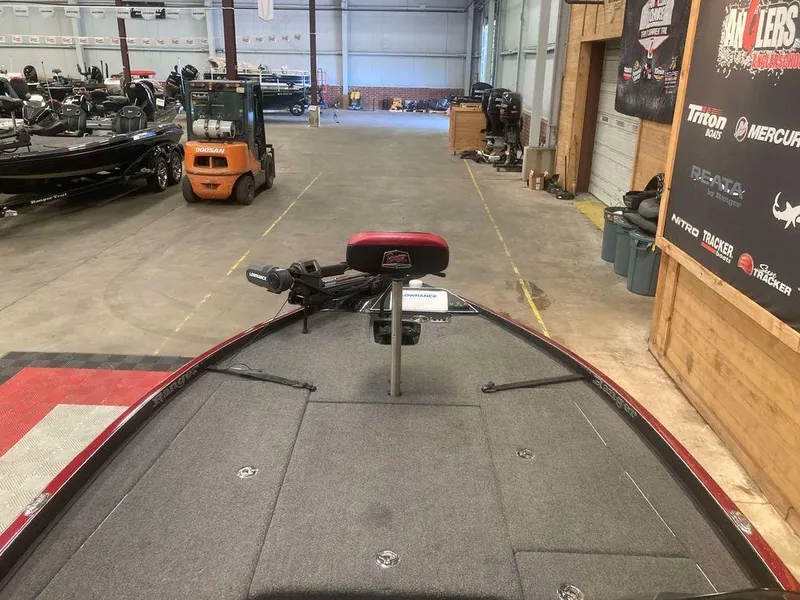 Slide: The Image of 2022 Ranger Z520R boat in a showroom, featuring a spacious deck and modern design. - 8