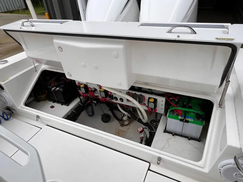 Slide: The Image of Open engine compartment of 2018 Everglades 273CC boat showing wiring and battery setup. - 14