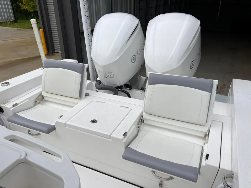 Slide: The Image of 2018 Everglades 273CC boat with dual engines and cushioned seating. - 15