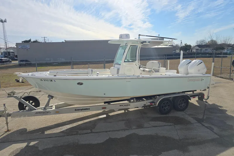 Slide: The Image of 2018 Everglades 273 Center Console boat on trailer, parked outdoors. - 20