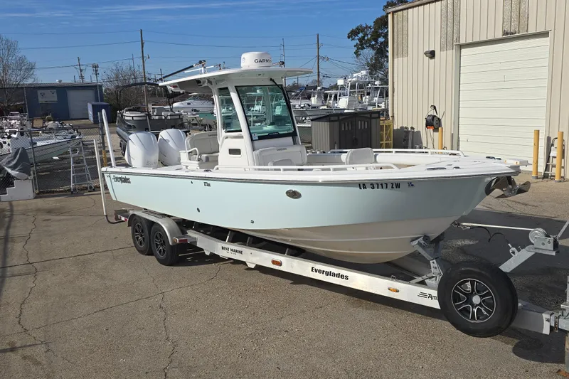 Slide: The Image of 2018 Everglades 273 Center Console boat on trailer, parked outdoors. - 22